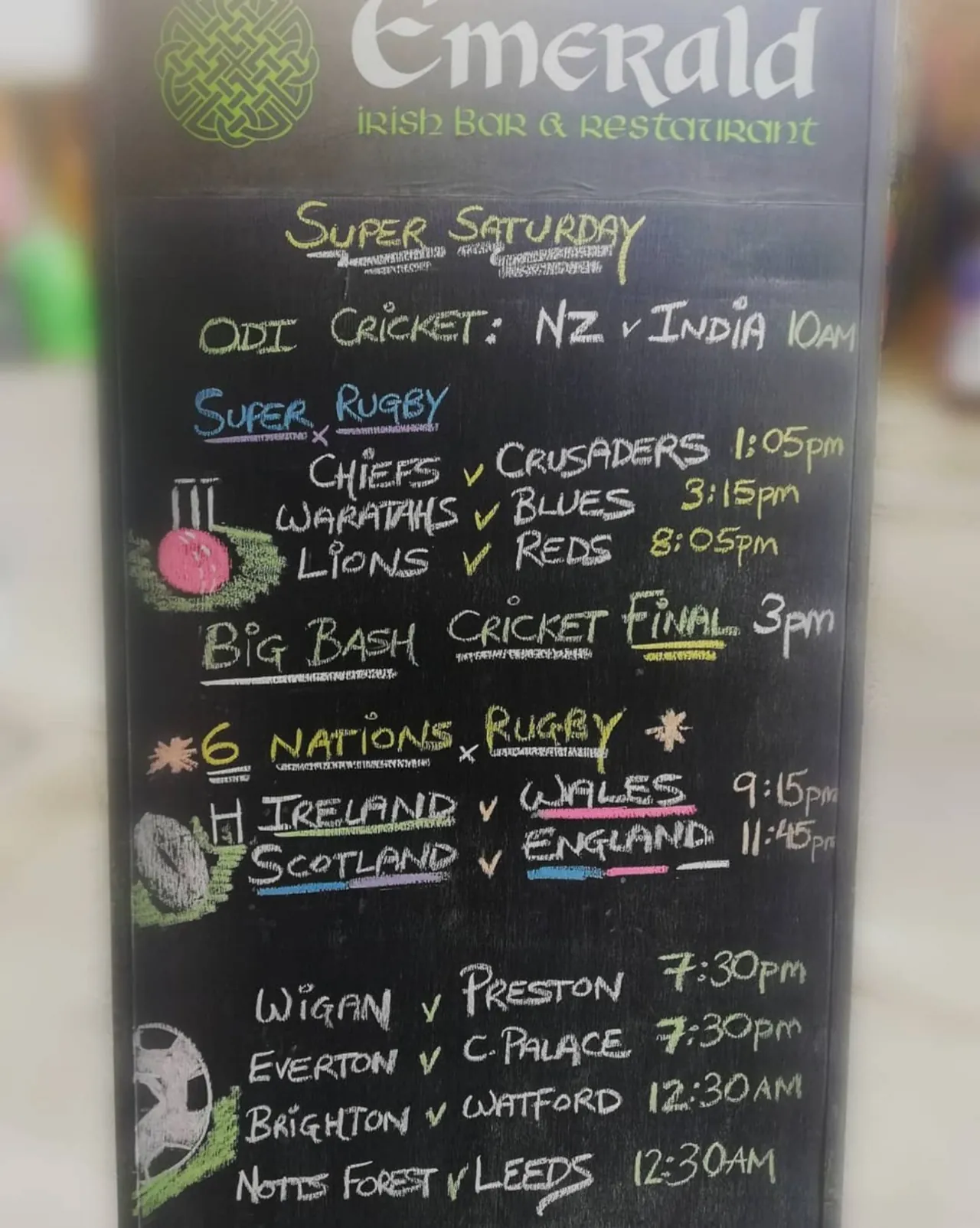 The Emerald's chalkboard listing a Saturday of cricket, rugby and football